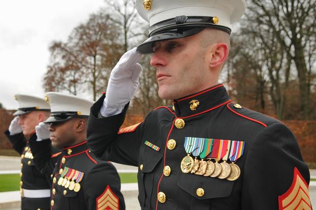 Marine Staff Sgt. Scott Pence, U.S. Embassy Marine detachment commander for marine security in Luxembourg, salutes during the Veteran’s Day ceremony at the Luxembourg American Cemetery and Memoria.. (U.S. Air Force/Senior Airman Nick Wilson)