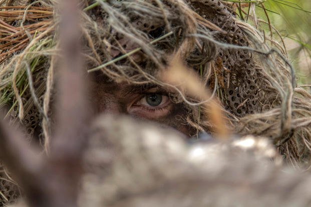 A Special Forces soldier stalks a target during a reconnaissance and surveillance exercise at Joint Base Cape Cod, Mass., June 8, 2018. (U.S. Army photo by Spc. Samuel Keenan)