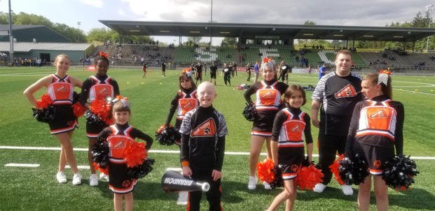 Brandon, front, is one of the members of the Joint Base Lewis-McChord, Washington Special Olympics cheer team hoping to head to the world games. (Photo courtesy of Stacie Pogoncheff)