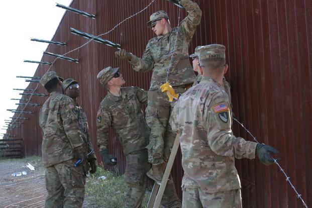 U.S. Soldiers, assigned to 937th Route Clearance Company, install concertina wire pickets near the Sasabe Port of Entry, Arizona, November 28, 2018. (U.S. Army/Spc. Jennily LeonRodriguez)