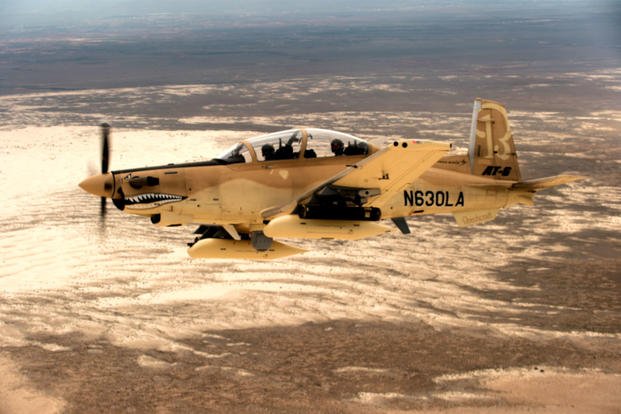 A Beechcraft AT-6B Wolverine experimental aircraft flies over White Sands Missile Range, N.M. The AT-6 is participating in the U.S. Air Force Light Attack Experiment (OA-X), a series of trials to determine the feasibility of using light aircraft in attack roles. (US Air Force photo by Ethan D. Wagner)