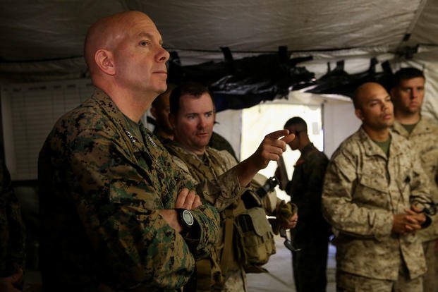 Lieutenant Gen. David Berger, commanding general, I Marine Expeditionary Force, gets briefed by Lt. Col. Christopher T. Steele, commanding officer, 2nd Battalion, 7th Marine Regiment, 1st Marine Division as he visits the unit during Integrated Training Exercise 2-16 aboard Marine Corps Air Ground Combat Center Twentynine Palms, Calif., Feb. 12, 2016. (U.S. Marine Corps photo/Danielle Rodrigues)