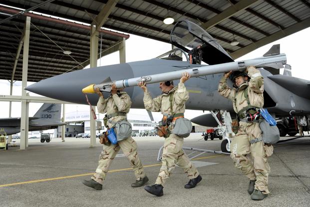 FILE PHOTO --Members of the Oregon Air National Guard remove training missiles from a F-15C Eagle after an afternoon sortie as part of combat readiness training, Sept. 8, 2018. (U.S. Air National Guard/Master Sgt. John Hughel, 142nd Fighter Wing Public Affairs)