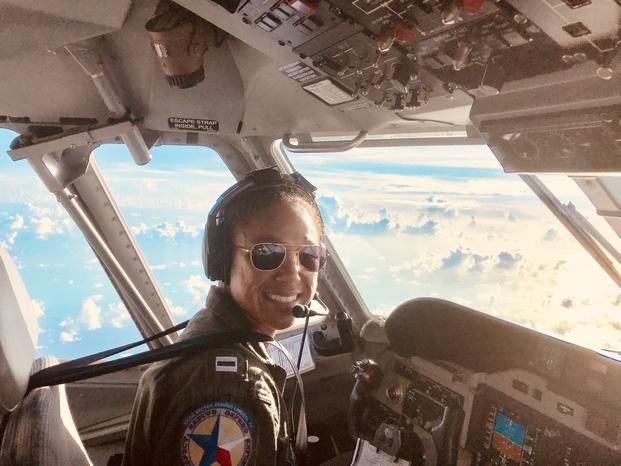 Coast Guard Lt. Ronaqua Russell flies an Air Station Corpus Christi HC-144 in support of Hurricane Maria response efforts in October 2018. (Ryan P Kelley/U.S. Coast Guard)