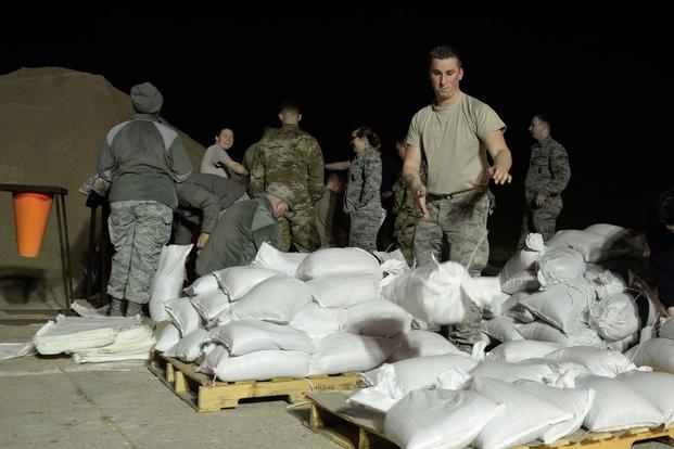 Members of Team Offutt fill sandbags March 15, 2019 at Offutt Air Force Base Nebraska during preparations for anticipated flooding of the base. (U.S. Air Force/TSgt. Rachelle Blake)