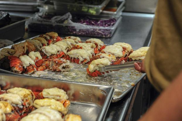 Culinary Specialist 2nd Class Armando Arteaga prepares lobster tails for a wardroom brunch aboard amphibious assault ship USS Boxer (LHD 4) on Aug. 5, 2018. (U.S. Navy photo by Mass Communication Specialist 2nd Class Dale M. Hopkins)