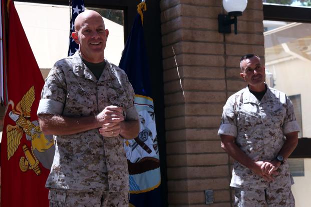 Lieutenant Gen. David H. Berger (left), commanding general, I Marine Expeditionary Force, speaks before promoting Brig. Gen. Vincent A. Coglianese (right), commanding general, 1st Marine Logistics Group, to major general aboard Camp Pendleton, California, August 2014. (Sarah Fiocco/U.S. Marine Corps)