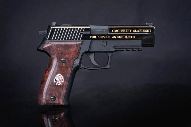 Commemorative pistol presented by Sig Sauer to retired Master Chief Special Warfare Operator Britt Slabinski to coincide with the launch of the documentary “For Service As Set Forth: The Story of CMC Britt Slabinski, Congressional Medal of Honor Recipient.” (Courtesy of Sig Sauer)