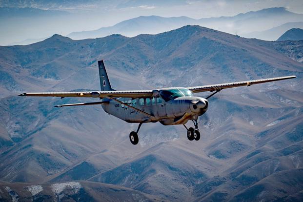 An Afghan pilot conducts training in a C-208 Caravan over Kabul, Afghanistan as part of the Train Advise and Assist Command's (TAAC-Air) mission on Dec. 18, 2018. (U.S. Air Force photo/Maygan Straight)