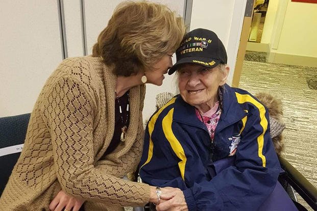 Charlotte Schwid speaks with Alaska Sen. Lisa Murkowski at a recent Honor Flight homecoming in Anchorage, Alaska. (Photo courtesy of the Schwid family)