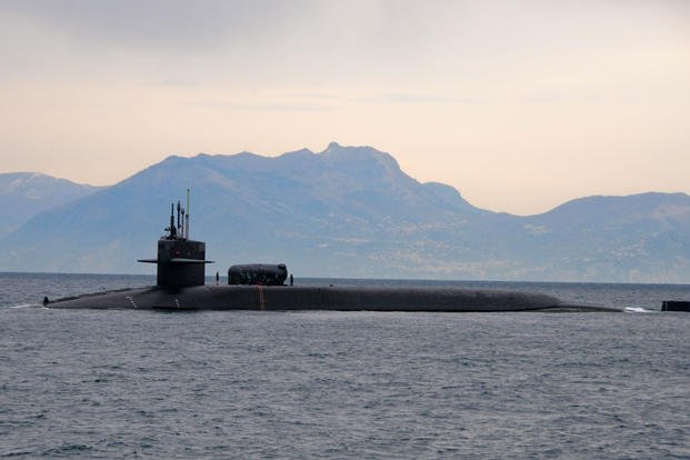 The guided missile submarine USS Florida (SSGN 728) pulls into the Bay of Naples, March 4, 2011. (U.S. Navy photo/Daniel Viramontes)