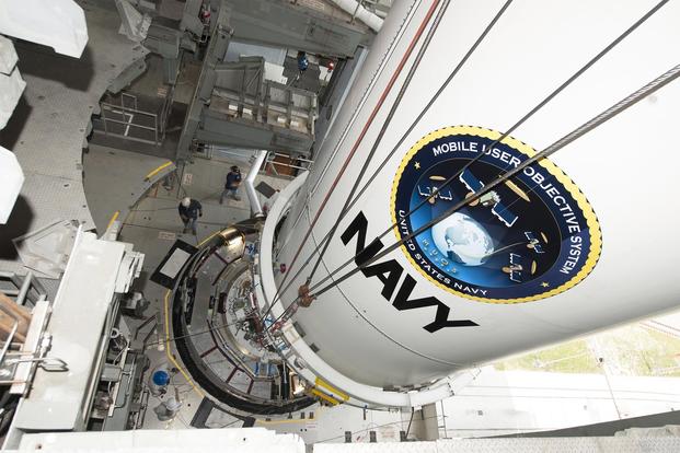 The U.S. Navy's fourth Mobile User Objective System satellite, encapsulated in a 5-meter payload fairing, is mated to an Atlas V booster inside the Vertical Integration Facility at Cape Canaveral, Aug. 19, 2015) (Photo courtesy United Launch Alliance)