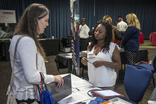 Janice Taylor, a representative from the Defense Finance & Accounting Service speaks with a potential candidate Sept. 19, 2018 during the Joint Base San Antonio-Fort Sam Houston, Texas, DoD Hiring Heroes Career Fair. (U.S. Air Force/Michael L. Watkins, Jr.)