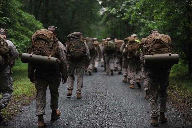 Permanent personnel Marines from The Basic School conduct a 10-mile hike on the west side of Marine Corps Base Quantico, Virginia, on July 1, 2013. Lance Cpl. Cuong Le/Marine Corps
