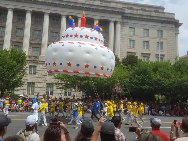A birthday cake float moves down Constitution Avenue in Washington, D.C. during the 2019 July 4 parade. (Richard Sisk/Staff)