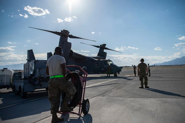 Maintainers from Hurlburt Field, Fla., and Cannon AFB, New Mexico prepare a V-22 Osprey for takeoff, June 5, 2019, at Nellis AFB, Nev. (U.S. Air Force photo/Jeremy Wentworth)