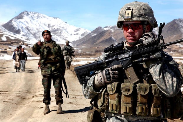 A soldier in Afghanistan stands with an M150 Rifle Combat Optic on his M4. The Army wants to replace the RCO with a variable-power Direct View Optic. (U.S. Army photo)