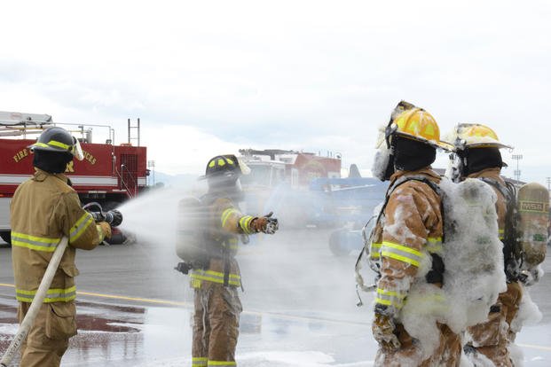 Firefighters assigned to the 673d Civil Engineer Squadron train during the foam test at Hangar 18 on Joint Base Elmendorf-Richardson, Alaska, Aug. 31, 2017. (U.S. Air Force photo/Caitlin Russell)