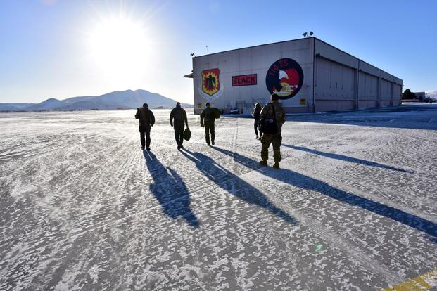 Air Force Gen. Mike Holmes, the commander of Air Combat Command, follows Col. Geoff Jensen, the 173rd Operations Group commander, toward a waiting F-15 for a flight at Kingsley Field, Oregon, Feb. 6, 2019. Although the weather is cold, its average of 300 days of sunshine in a given year make it an ideal place to train Eagle pilots. (Jefferson Thompson/U.S. Air National Guard)