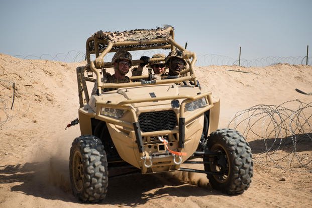 Marines with Kilo company, 3rd Battalion, 5th Marine Regiment, rush to provide support for other Marines in a MRZR at Marine Corps Air Ground Combat Center Twentynine Palms, Calif., July 31, 2016. (U.S. Marine Corps photo/Julien Rodarte)