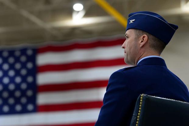 Col. Stephen Jones, incoming 432nd Wing/432nd Air Expeditionary Wing commander, looks out at the crowd as Maj. Gen. Andrew Croft, Twelfth Air Force (Air Forces Southern) commander, gives opening remarks during the 432nd WG/432nd AEW change of command ceremony at Creech Air Force Base, Nevada, on June 7, 2019. (U.S. Air Force photo by Airman 1st Class Haley Stevens)