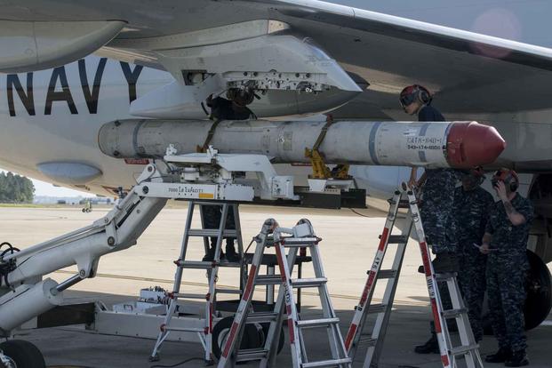 Crewmen load an AGM-84K SLAM-ER missile on a P-8A Poseidon in preparation for a conventional weapons technical proficiency inspection. (U.S. Navy/Mass Communication Specialist 3rd Class Jason Kofonow)