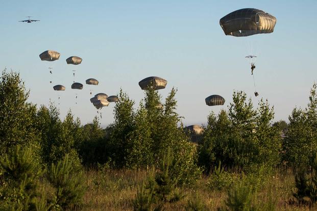 U.S. Army paratroopers assigned to the 3rd Brigade Combat Team, 82nd Airborne Division, jump from an aircraft near Rukla, Lithuania, as part of Swift Response 18 June 9, 2018 (U.S. Army/Spc. Andrew McNeil)