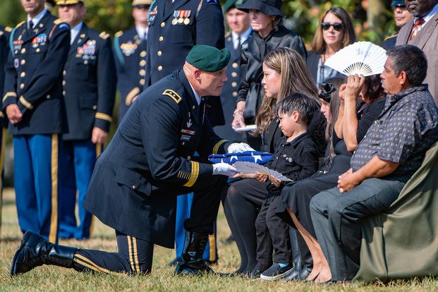 Soldiers from the 3d U.S. Infantry Regiment (The Old Guard), the U.S. Army Band, “Pershing’s Own”, and the 3d U.S. Infantry Regiment (The Old Guard) Caisson Platoon conducted military funeral honors with funeral escort for U.S. Army Master Sgt. Jose Gonzalez in Section 60 of Arlington National Cemetery, Arlington, Virginia, Sept. 11, 2019. Gonzalez’s spouse, Brenda Carretero, received the flag from her husband’s casket. (U.S. Army photo/Elizabeth Fraser)