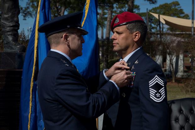 U.S. Air Force Lt. Gen. Jim Slife, commander of Air Force Special Operations Command, pins the Silver Star Medal onto U.S. Air Force Chief Master Sgt. Chris Grove, a Special Tactics combat controller assigned as the 720th Special Tactics Group superintendent, during a ceremony at Hurlburt Field, Florida, Nov. 15, 2019. Grove was awarded the nation’s third highest medal against an armed enemy of the United States in combat for his actions while deployed to Afghanistan in November 2007. Grove was originally a
