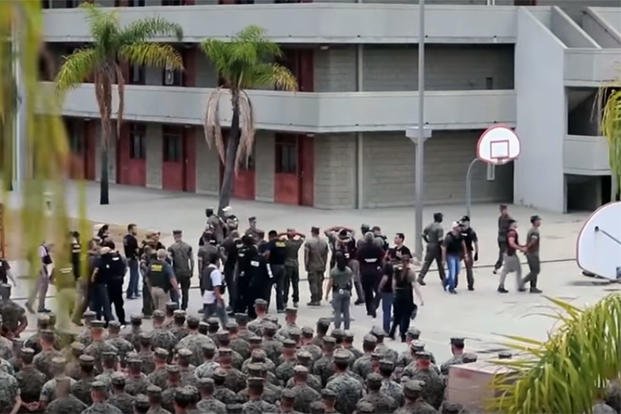 A screen grab from a YouTube video shows Marines being arrested during formation at Camp Pendleton in July, 2019. (Screen capture)