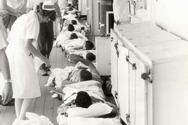 Helen Maznio prepares wounded aboard USS Sanctuary