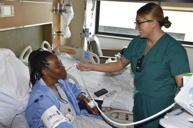 An Army nurse cares for a patient at Walter Reed National Military Medical Center. (Mark Oswell/Walter Reed National Military Medical Center)