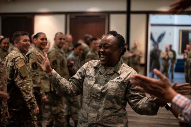 A U.S. Air Force Master Sgt. is lauded during a celebration for the master sergeants selected for promotion.