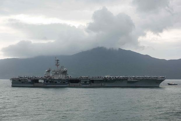 The aircraft carrier USS Roosevelt arrives in Vietnam.