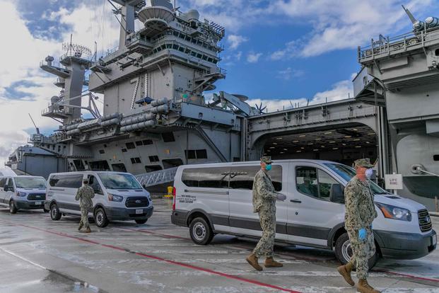 Seabees coordinate transportation of sailors from the USS Roosevelt to commercial lodging.