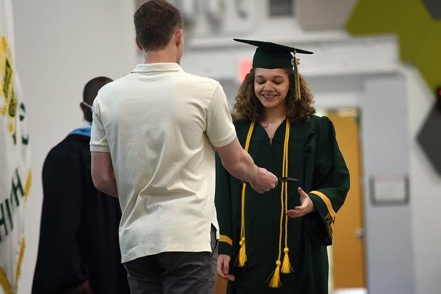 student receives diploma
