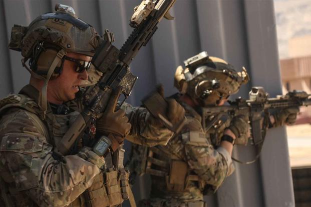 A U.S. Special Forces Soldier changes magazines after during a combat exercise.