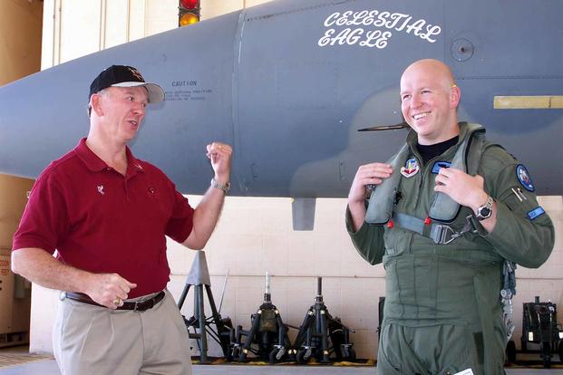 Retired Maj. Gen. Doug Pearson (left) and Capt. Todd Pearson joke around.