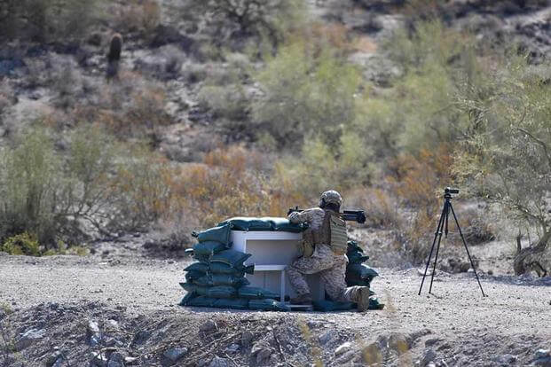 A test facility professional prepares to fire an M72 LAW Fire from Enclosure test round at an undisclosed test range in 2019.