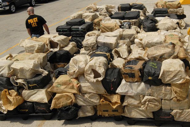 More than 30,000 pounds of pure cocaine sit on a pier.