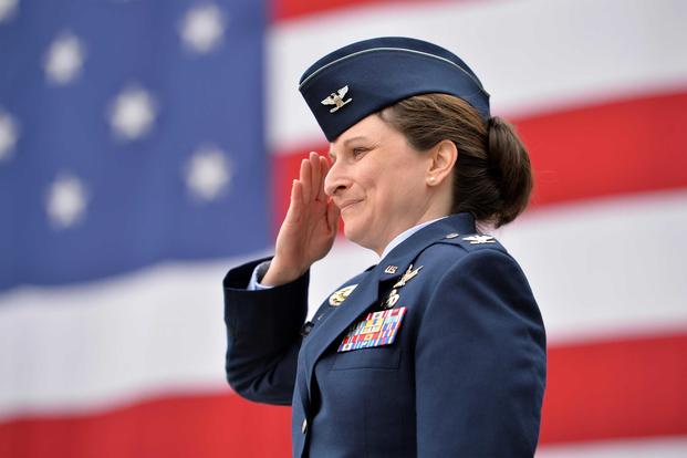 Col. Jennifer Grant renders her first salute to members of the 50th Space Wing.