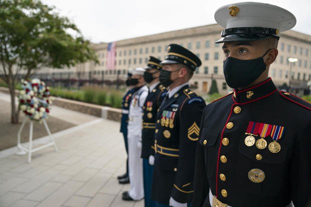 An honor guard stand at attention during the Pentagon 9/11 Observance Ceremony at the Pentagon Memorial, Washington D.C., Sept. 11, 2020. The ceremony was held in honor of the 184 people killed at the Pentagon during the Sept. 11, 2001 attacks. (Carlos M. Vasquez II/Navy)