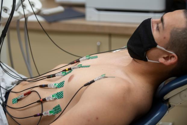 A midshipman 4th class from the U.S. Naval Academy Class of 2024 receives an electrocardiogram.