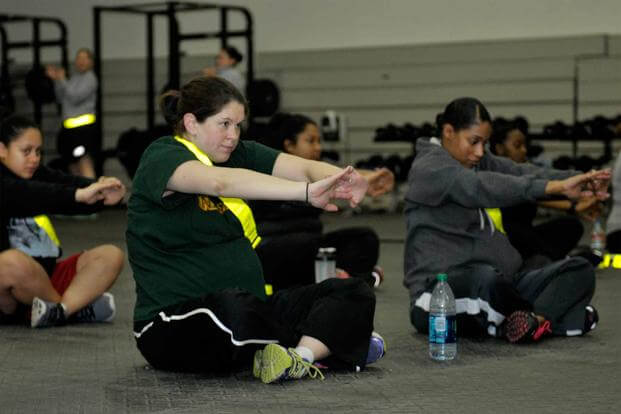 Soldiers in their third trimester perform the designated stretches.