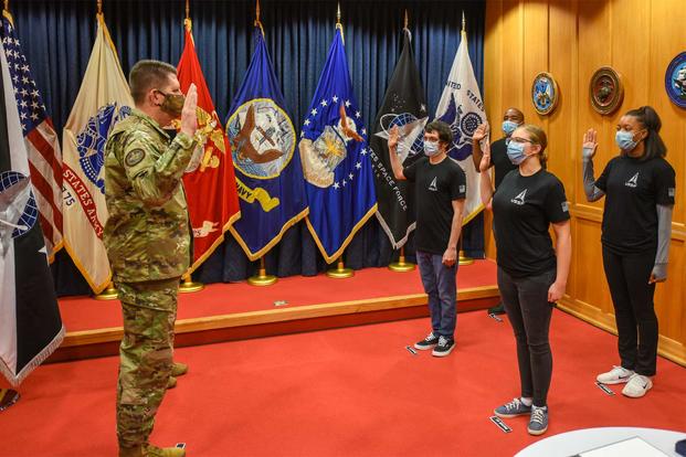 Gen. David D. “DT” Thompson swears in the first four Space Force recruits.