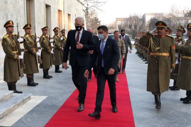 Christopher Miller enters a bilateral meeting with Afghan President Ashraf Ghani at Ghani’s palace