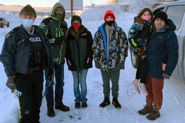 Gary Bath, Lynn Marchessault, Marchessault’s two children and Staff Sgt. Tim Marchessault at the Alaska-Yukon border