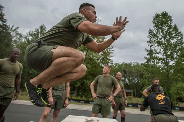 A Force Fitness Instructor student executes box jumps.
