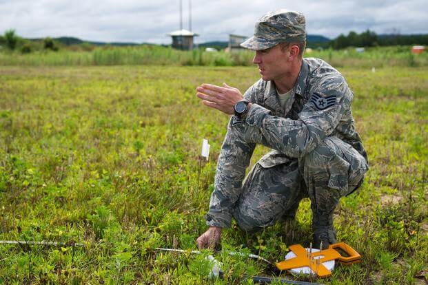 A USAF airman in the field trying to decide about buying a Blue Falcon patch from Challenge Coin Nation because a coworker took his idea and used it as his own