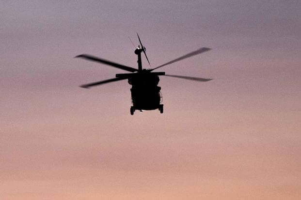 Idaho Army National Guard crewmembers fly a UH-60 Black Hawk 